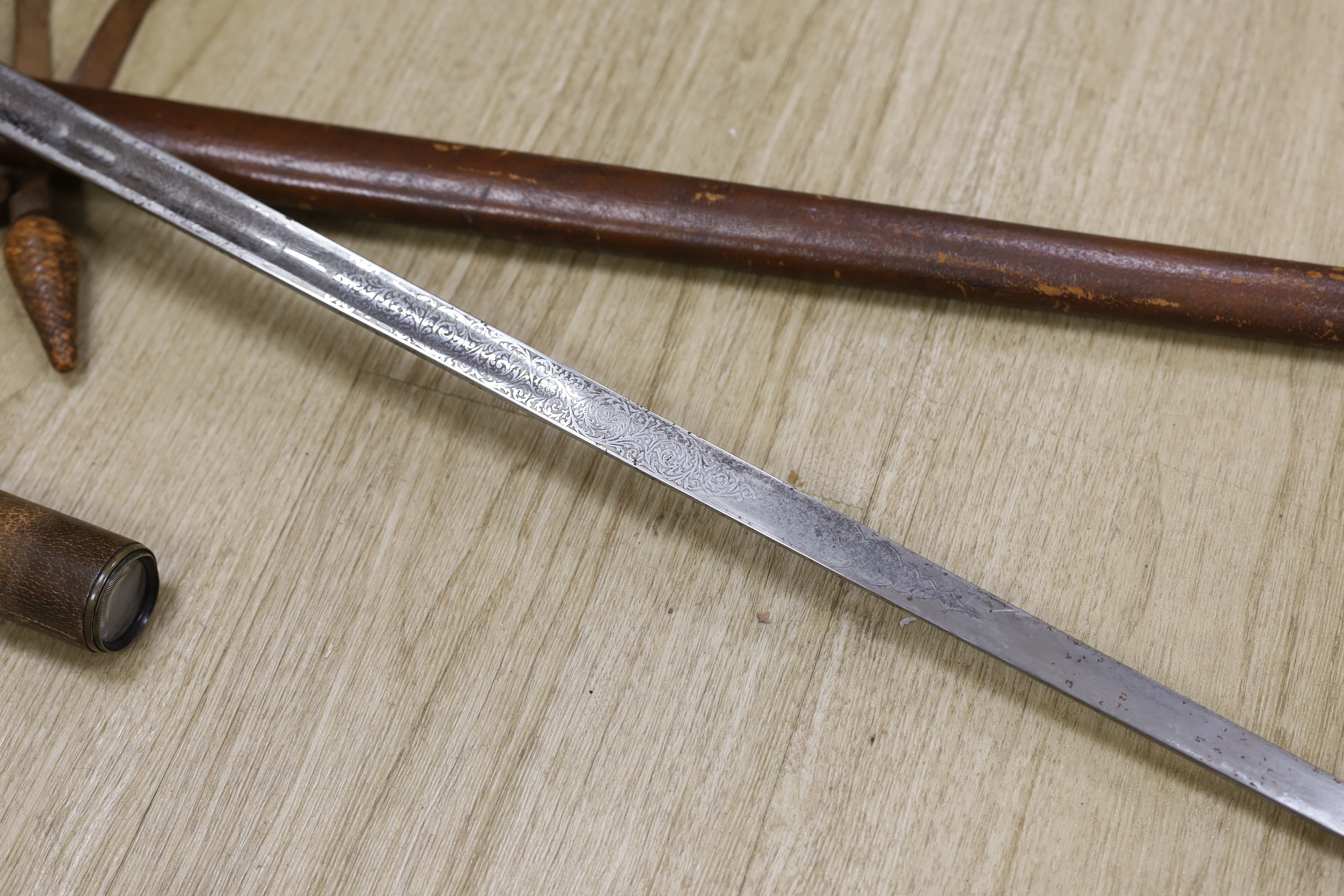 A Victorian officer’s dress sword, Wilkinson blade, together with a telescope, sword, 102cm in length